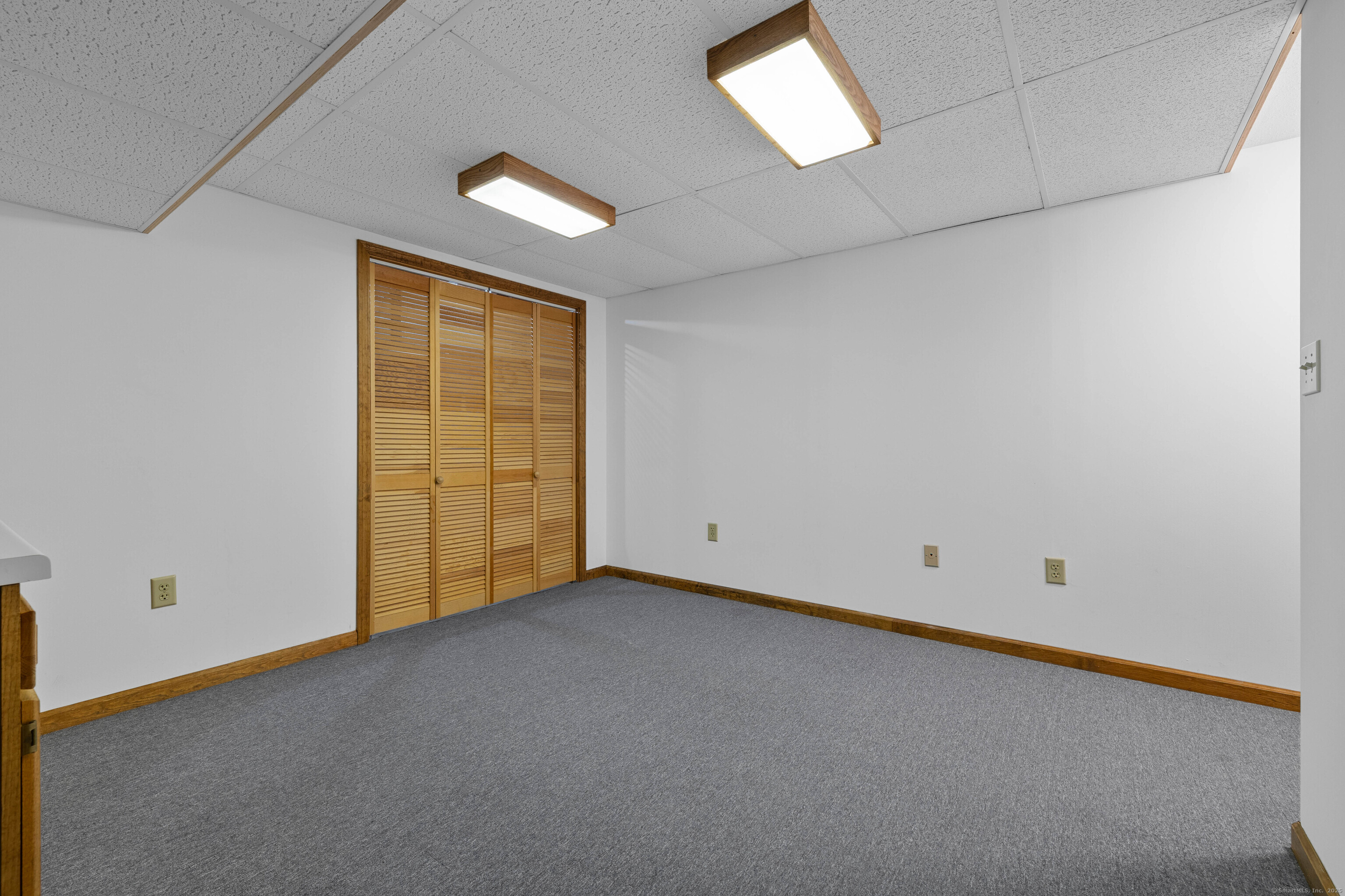 226 Austin Ryer Lane, Unit 226 Branford, CT 06405 - Photo 25 of 34 a view of an empty room with a window