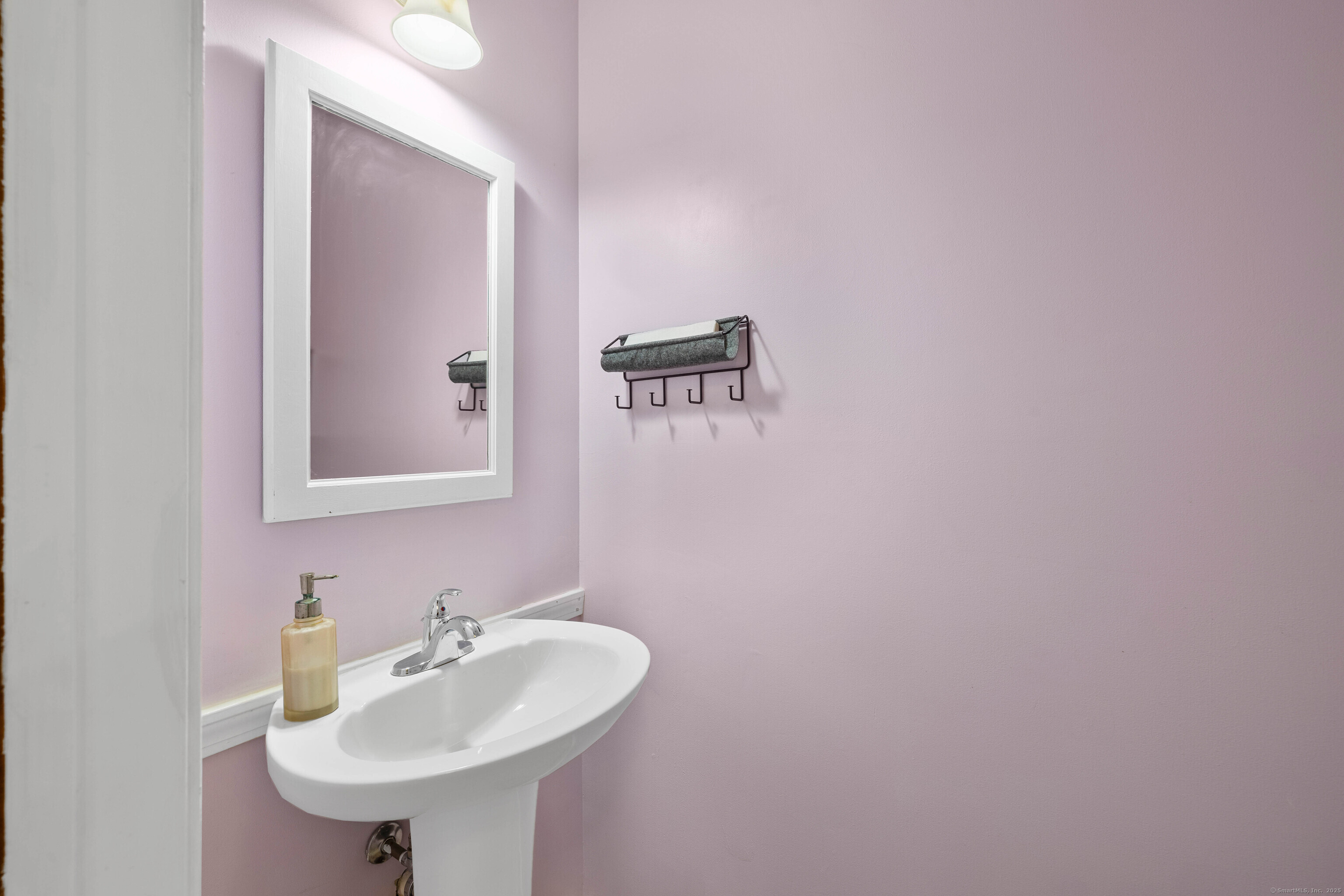 226 Austin Ryer Lane, Unit 226 Branford, CT 06405 - Photo 6 of 34 a bathroom with a sink and a mirror