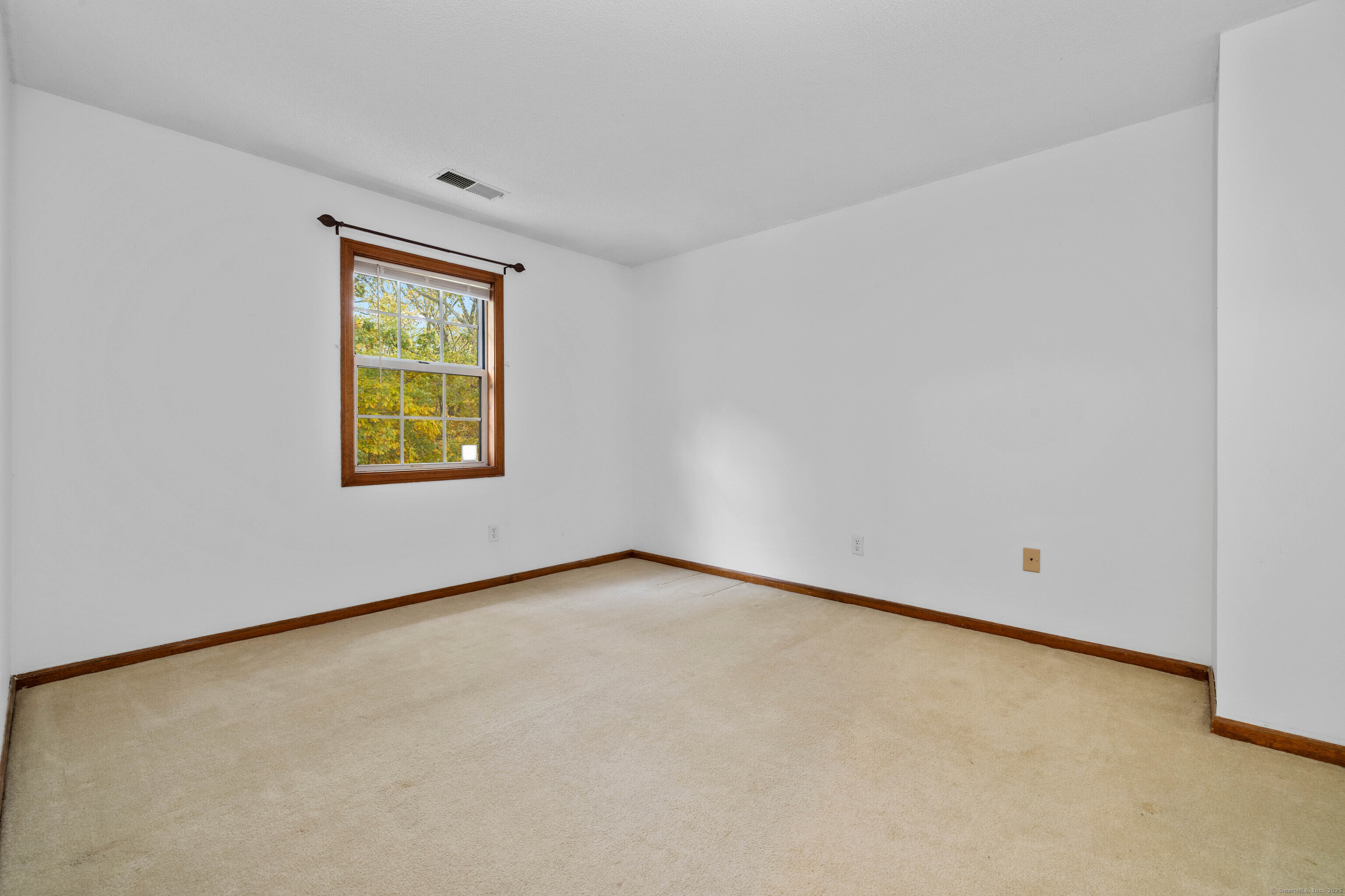 226 Austin Ryer Lane, Unit 226 Branford, CT 06405 - Photo 7 of 34 an empty room with a window