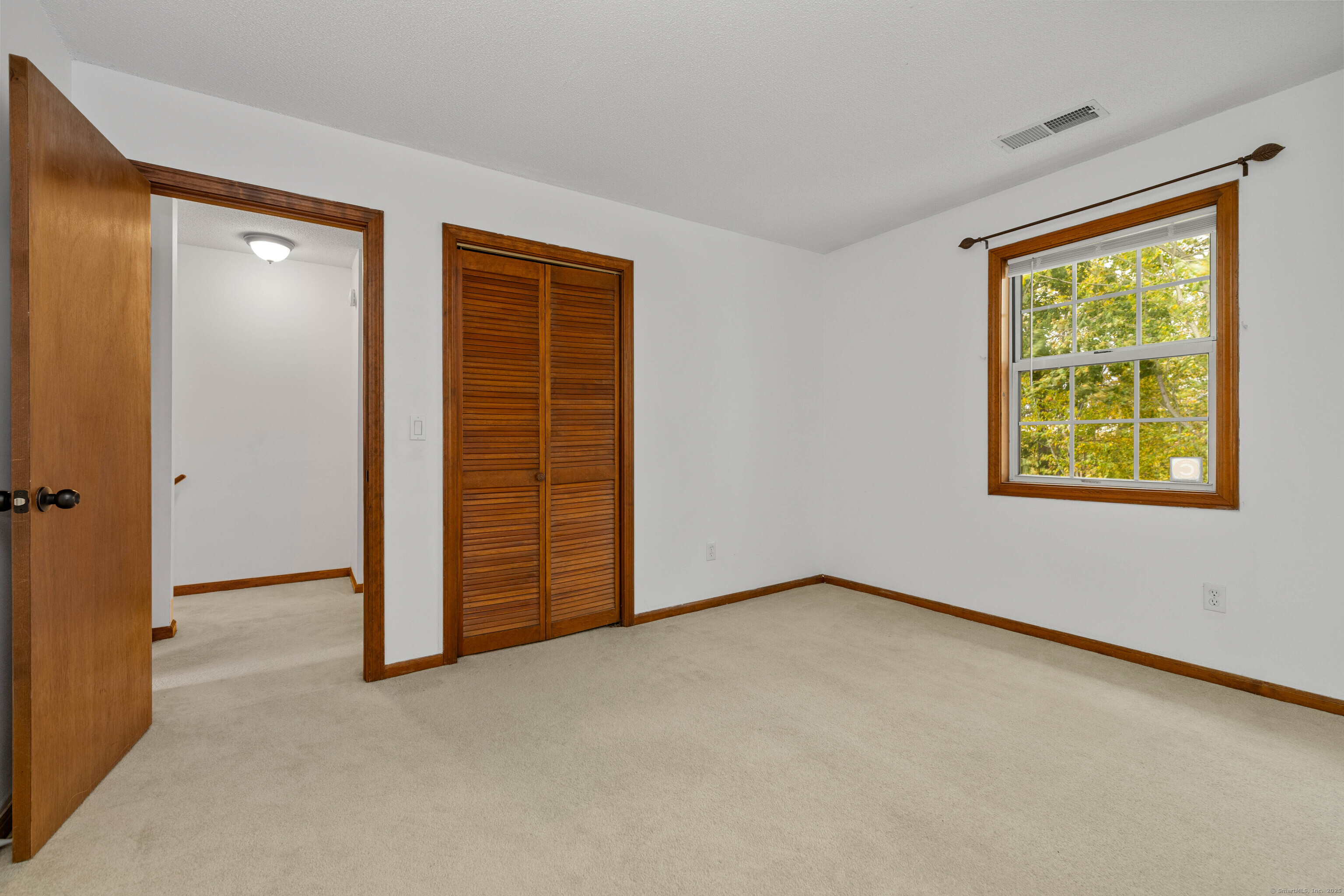 226 Austin Ryer Lane, Unit 226 Branford, CT 06405 - Photo 8 of 34 an empty room with window