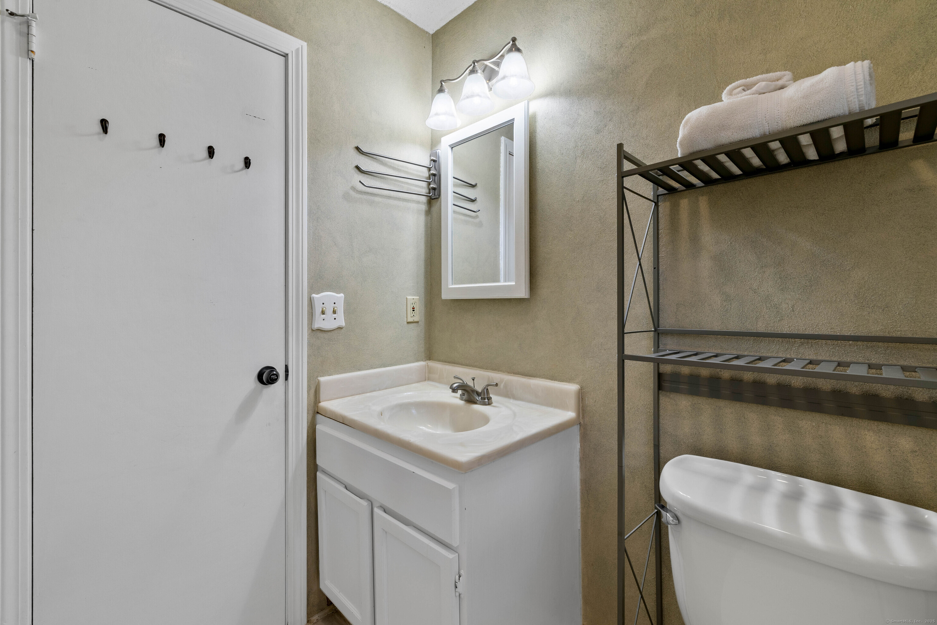 226 Austin Ryer Lane, Unit 226 Branford, CT 06405 - Photo 9 of 34 a bathroom with a sink a toilet and shower