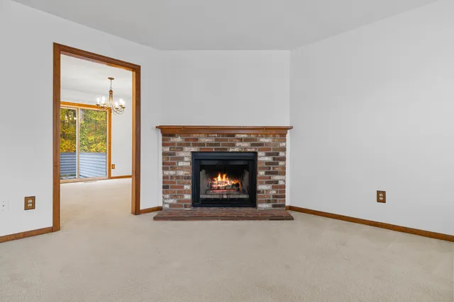 a an empty room with a fireplace