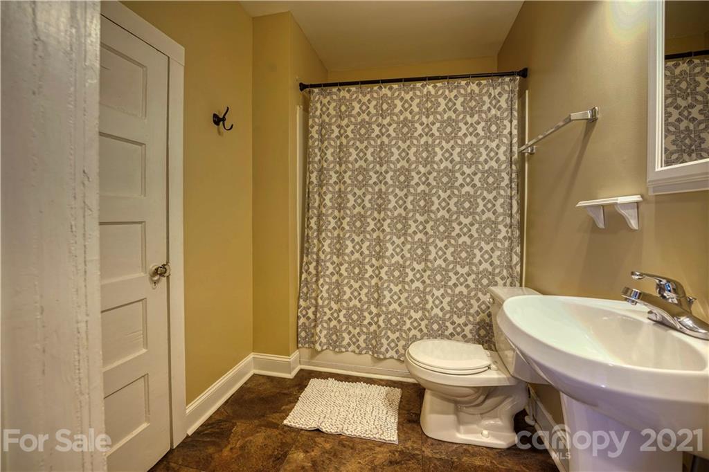 36 Bluff Avenue Southwest Concord, NC 28027 - Photo 15 of 18 a bathroom with a sink toilet and shower