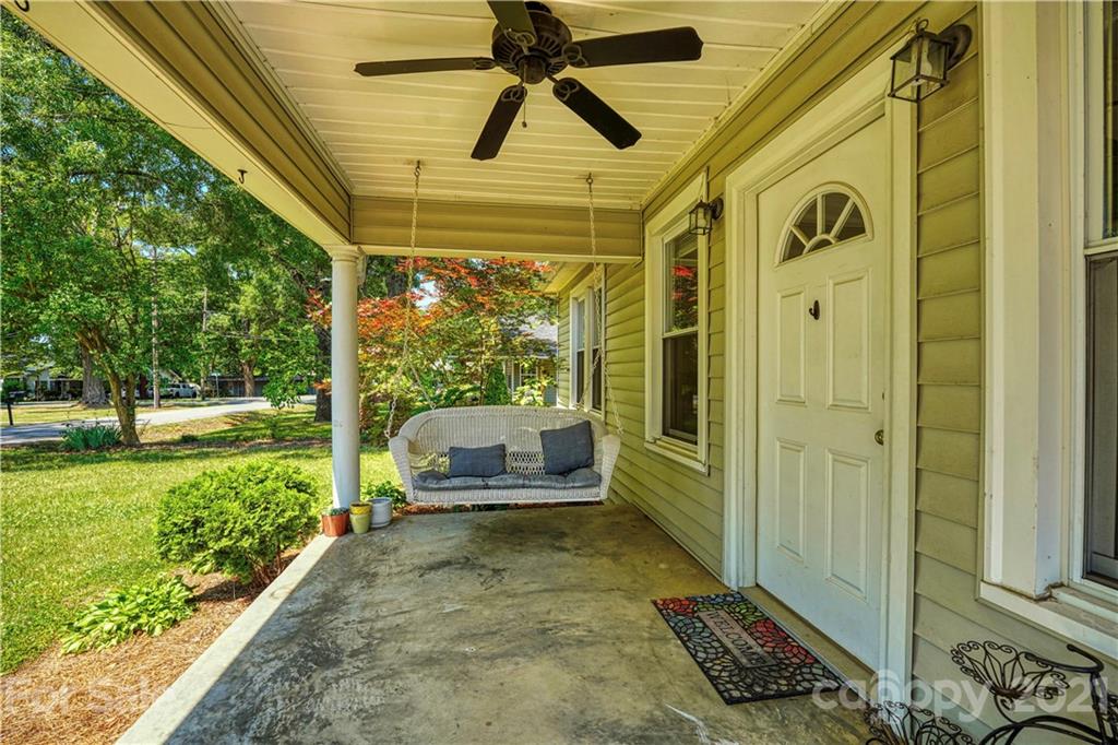 36 Bluff Avenue Southwest Concord, NC 28027 - Photo 3 of 18 a view of a porch with a table and chairs