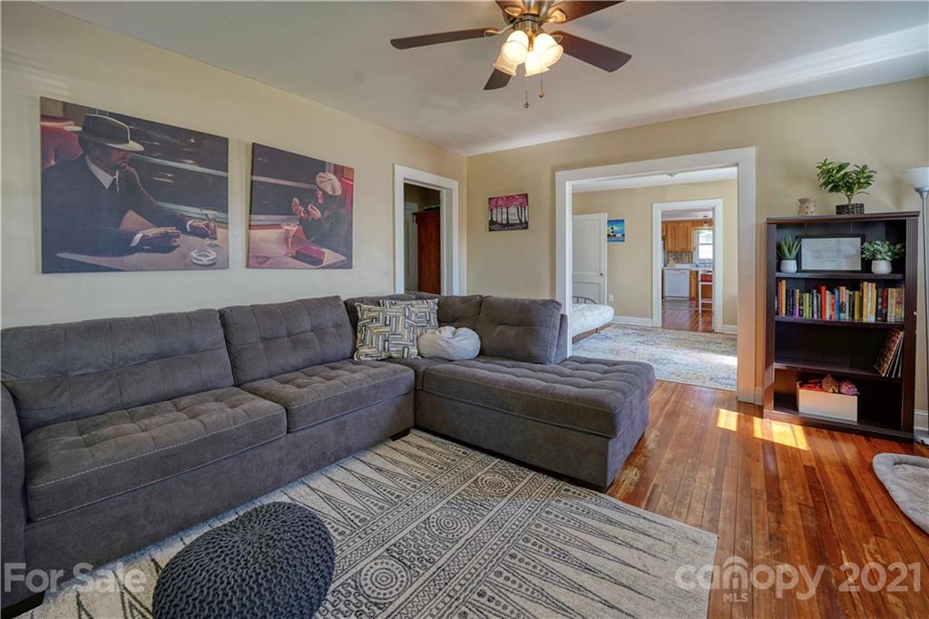 36 Bluff Avenue Southwest Concord, NC 28027 - Photo 4 of 18 a living room with furniture and a wooden floor