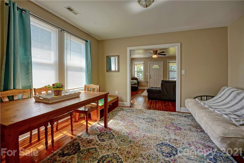36 Bluff Avenue Southwest Concord, NC 28027 - Photo 6 of 18 a bedroom with furniture and a wooden floor