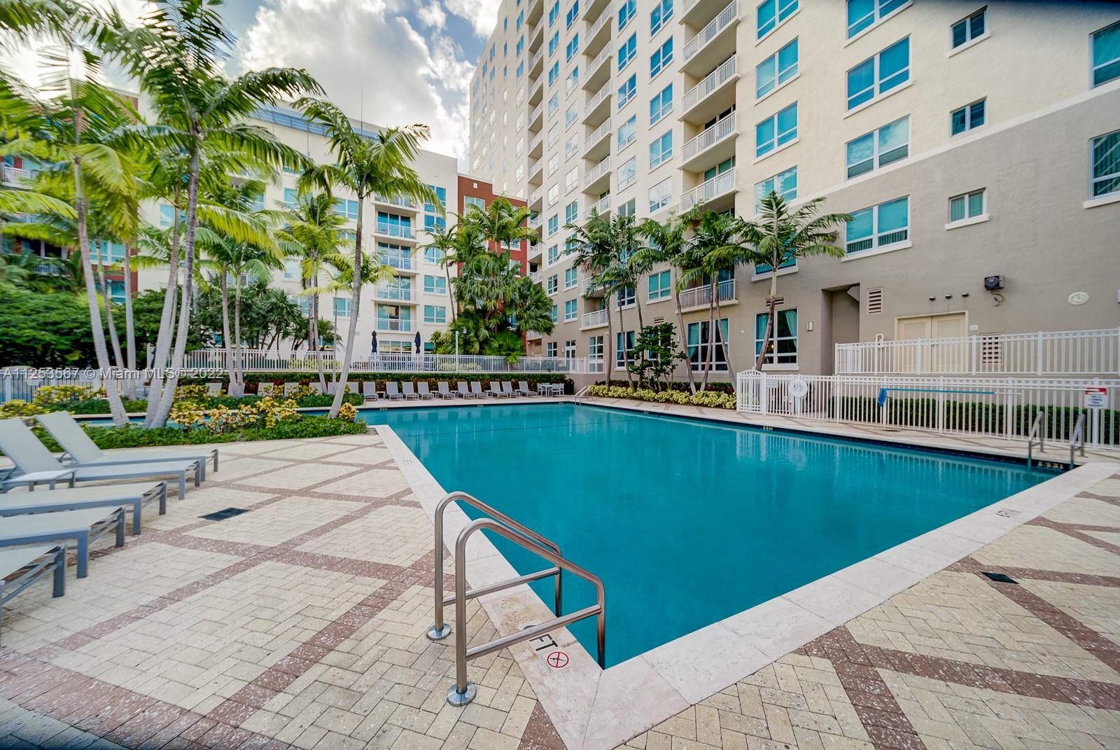 2001 Biscayne Boulevard, Unit 3401 Miami, FL 33137 - Photo 18 of 23 a view of a swimming pool with a patio