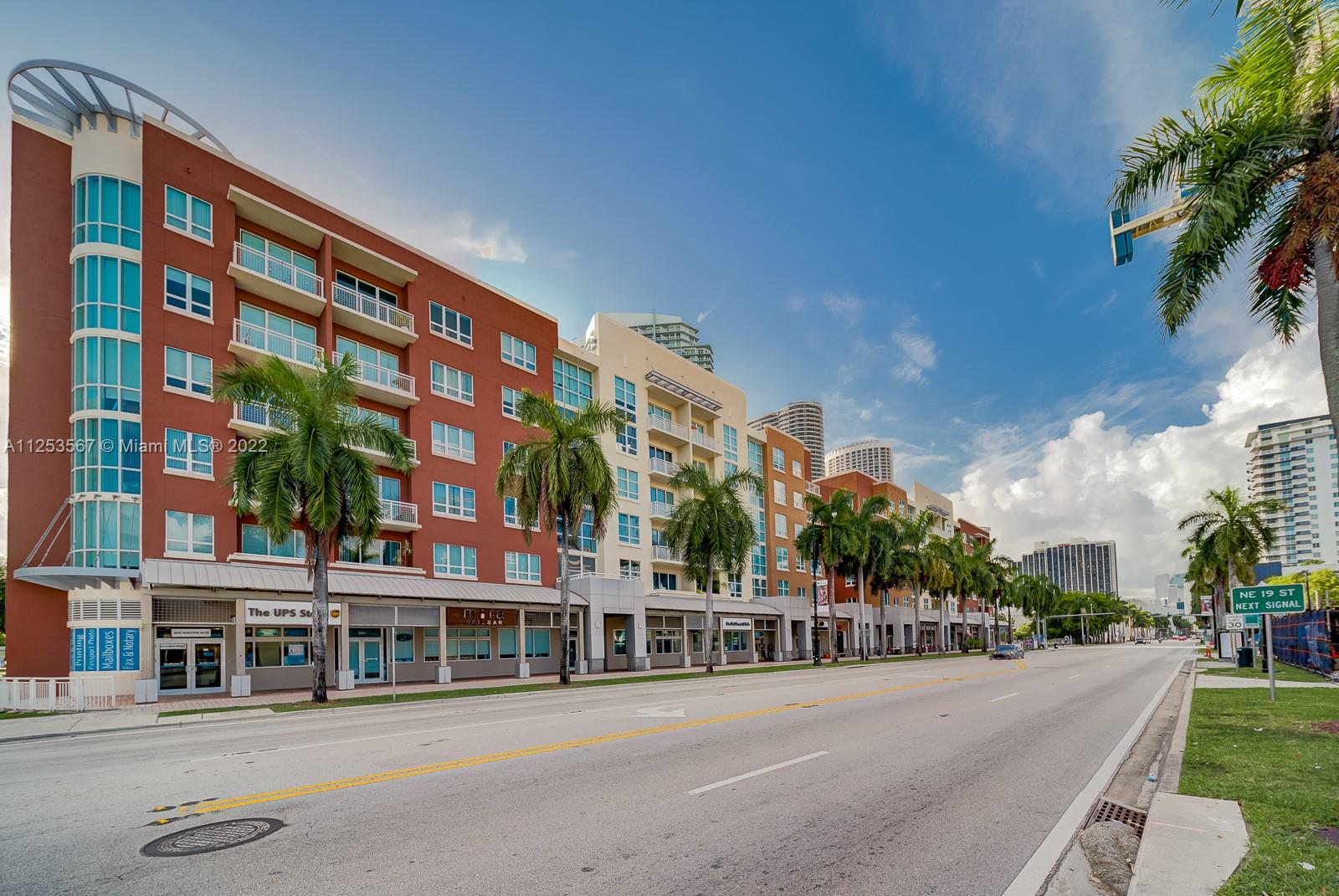 2001 Biscayne Boulevard, Unit 3401 Miami, FL 33137 - Photo 23 of 23 a city street lined with tall buildings and a yard