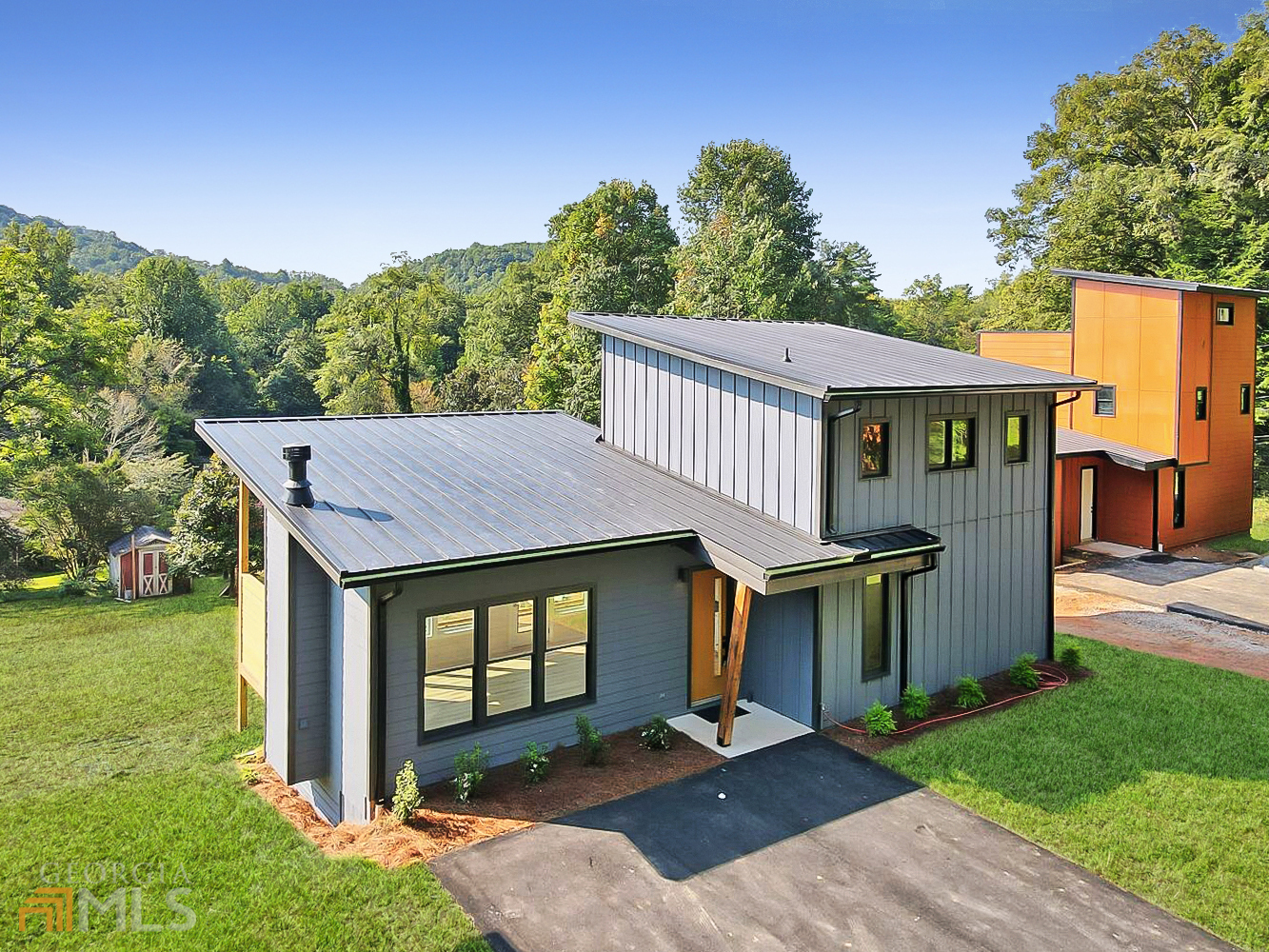 136 Cannon Street Clayton, GA 30525 - Photo 1 of 1 a view of a house with backyard and garden
