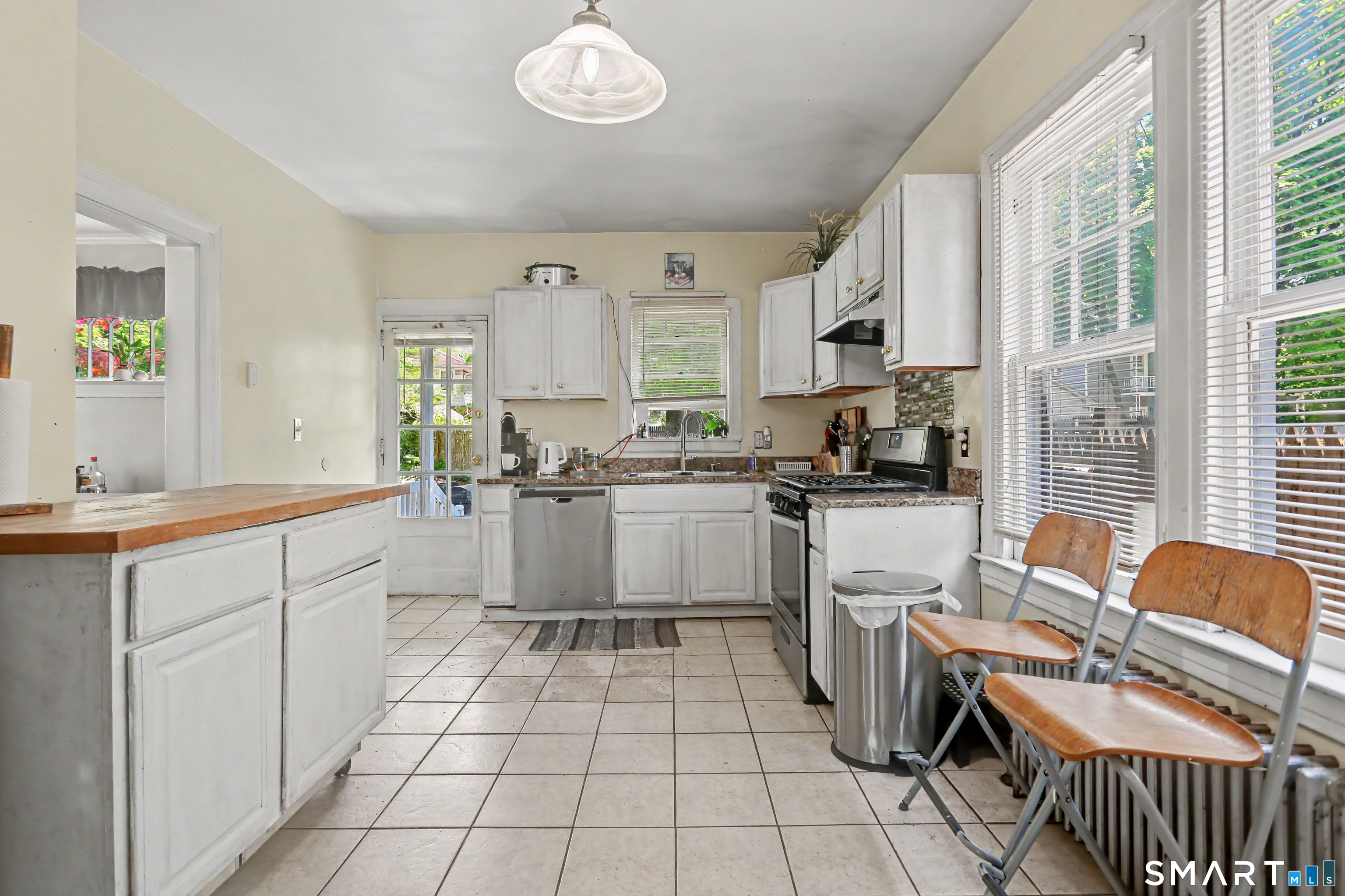 94 2nd Street Hamden, CT 06514 - Photo 16 of 31 a kitchen with a sink cabinets and window