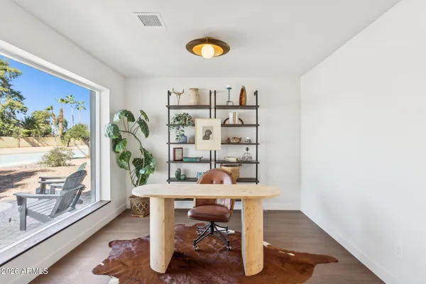 a living room with furniture and a rug