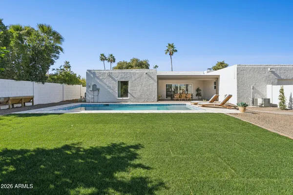 an aerial view of a house with a mountain view