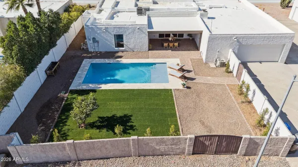 an aerial view of residential houses with outdoor space