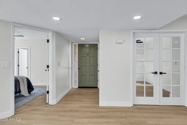 a view of a livingroom with closet and hallway
