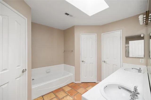 a bathroom with a sink a shower and a mirror