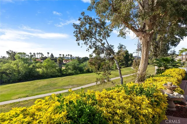 an aerial view of a swimming pool and mountain view in back