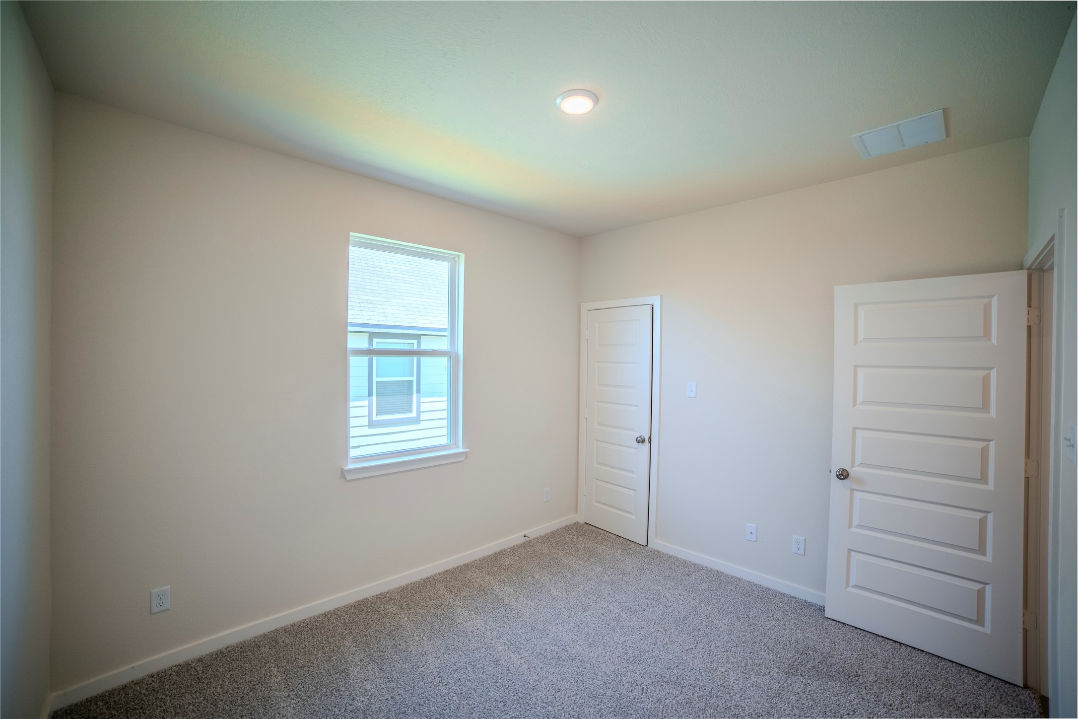 1402 Lk Rdg Drive Brenham, TX 77833 - Photo 10 of 35 an empty room with windows and closet
