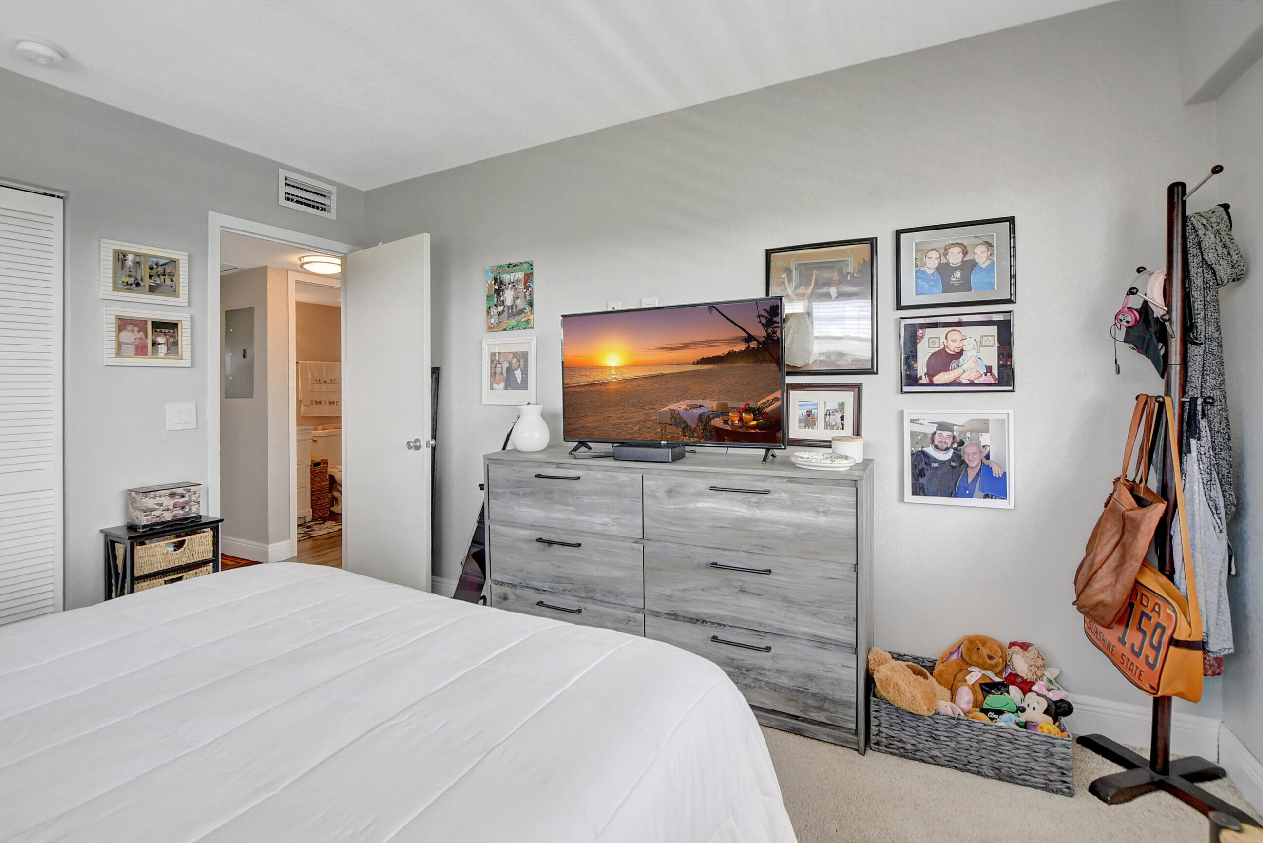 42 Brighton A Boca Raton, FL 33434 - Photo 13 of 24 a bedroom with a bed and a flat screen tv