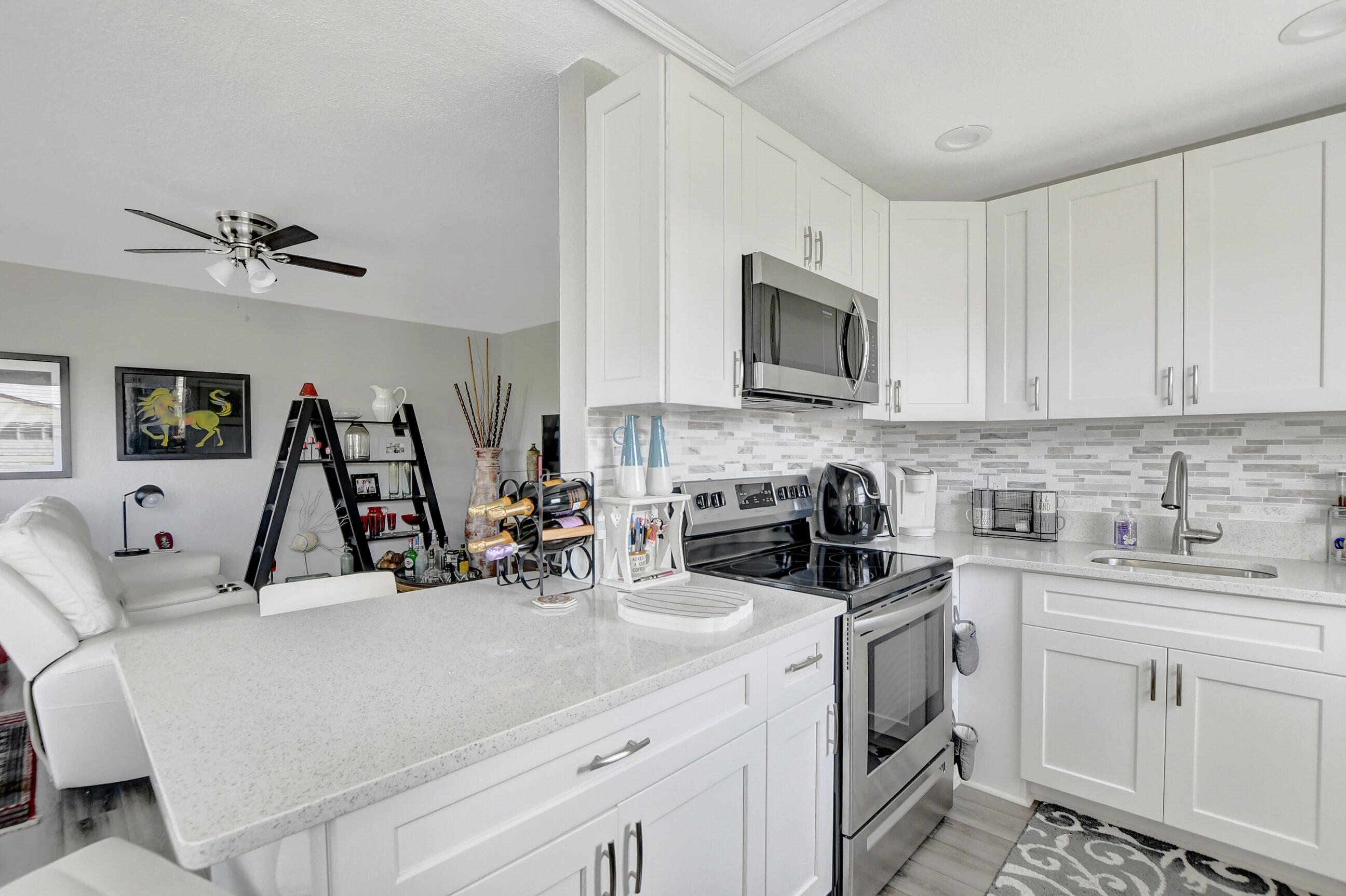 42 Brighton A Boca Raton, FL 33434 - Photo 4 of 24 a view of a kitchen with sink and cabinets