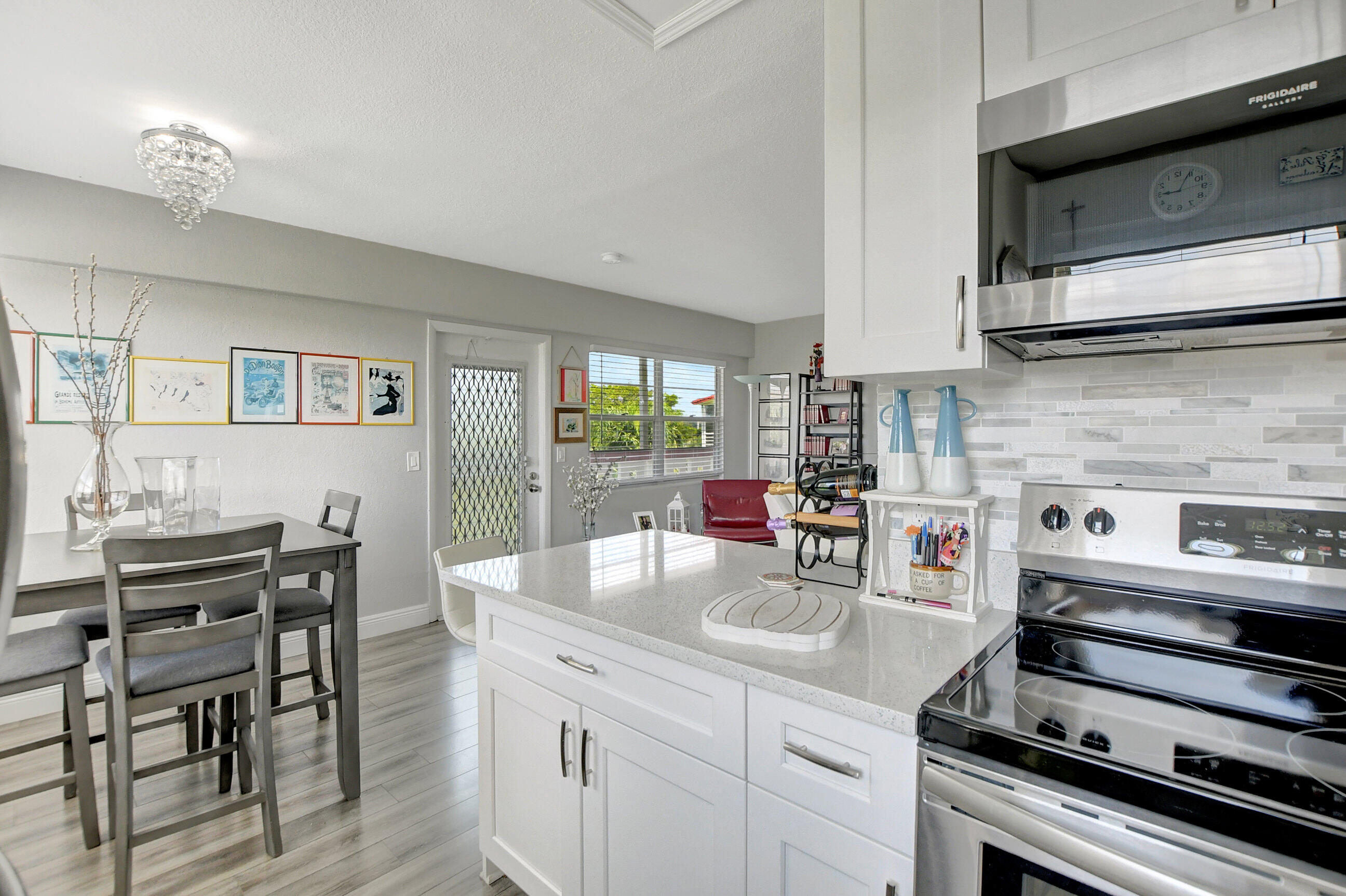 42 Brighton A Boca Raton, FL 33434 - Photo 5 of 24 a kitchen with a stove and cabinets
