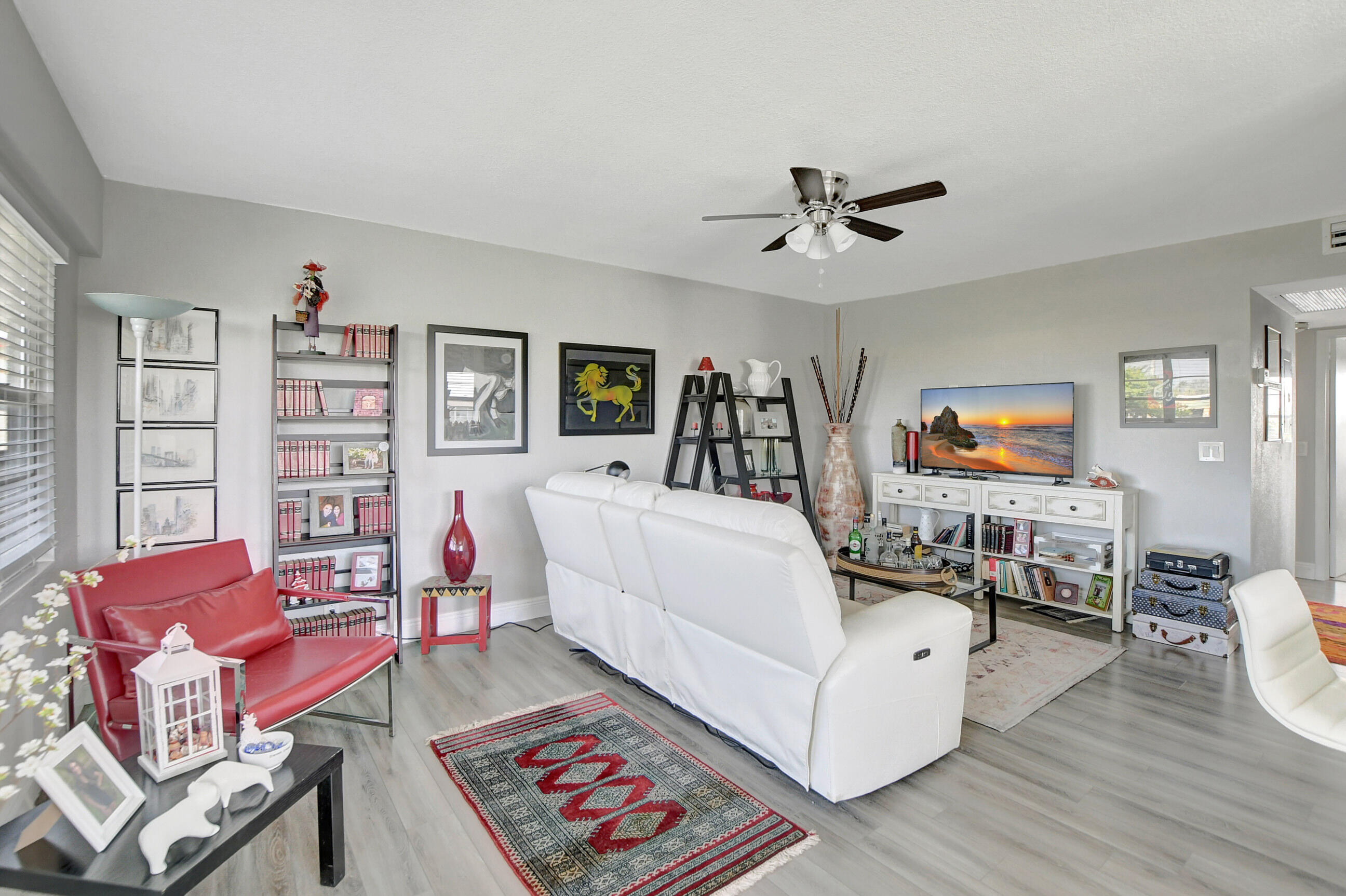 42 Brighton A Boca Raton, FL 33434 - Photo 6 of 24 a living room with furniture and a flat screen tv
