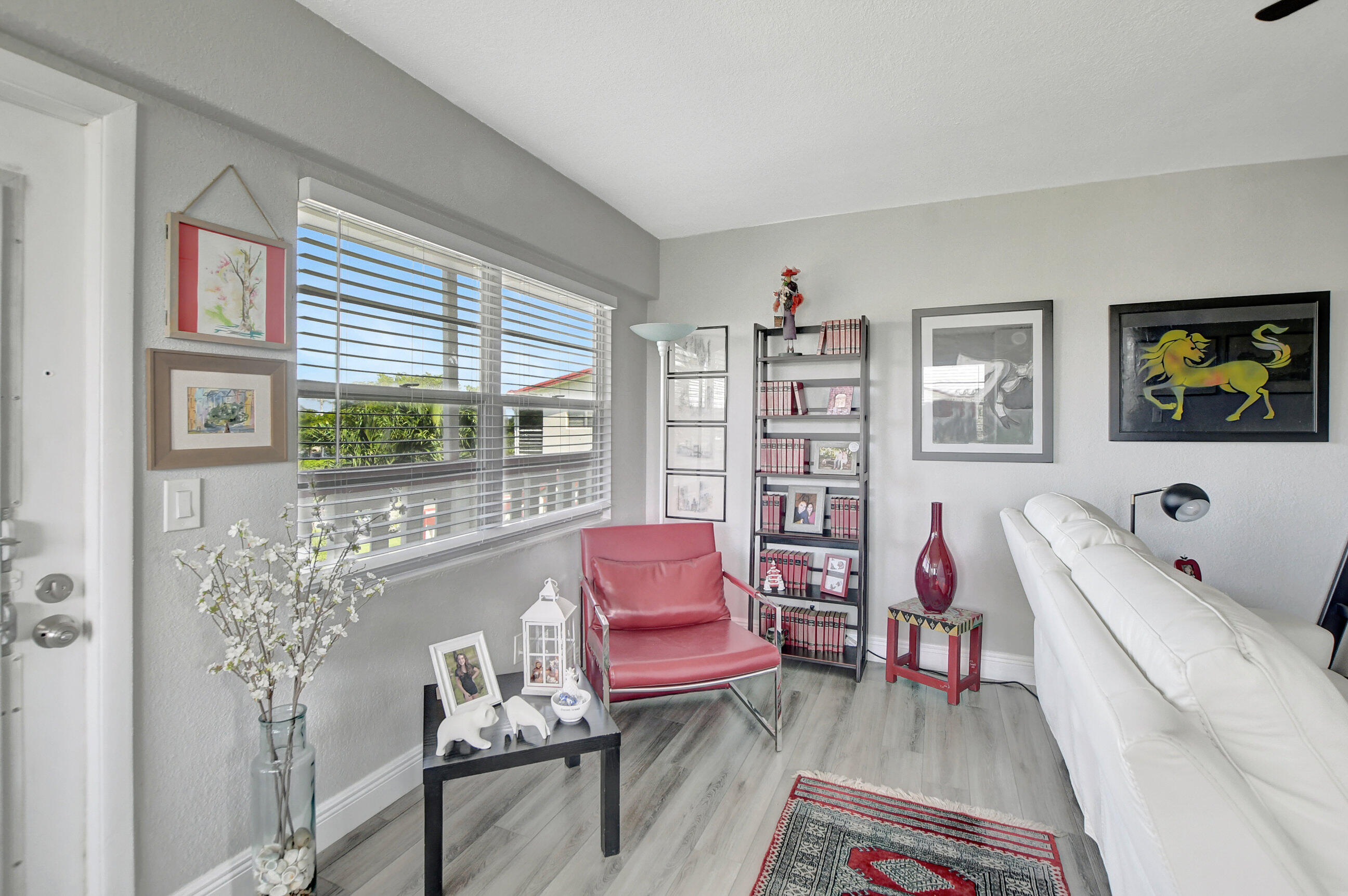 42 Brighton A Boca Raton, FL 33434 - Photo 7 of 24 a living room with furniture and a window