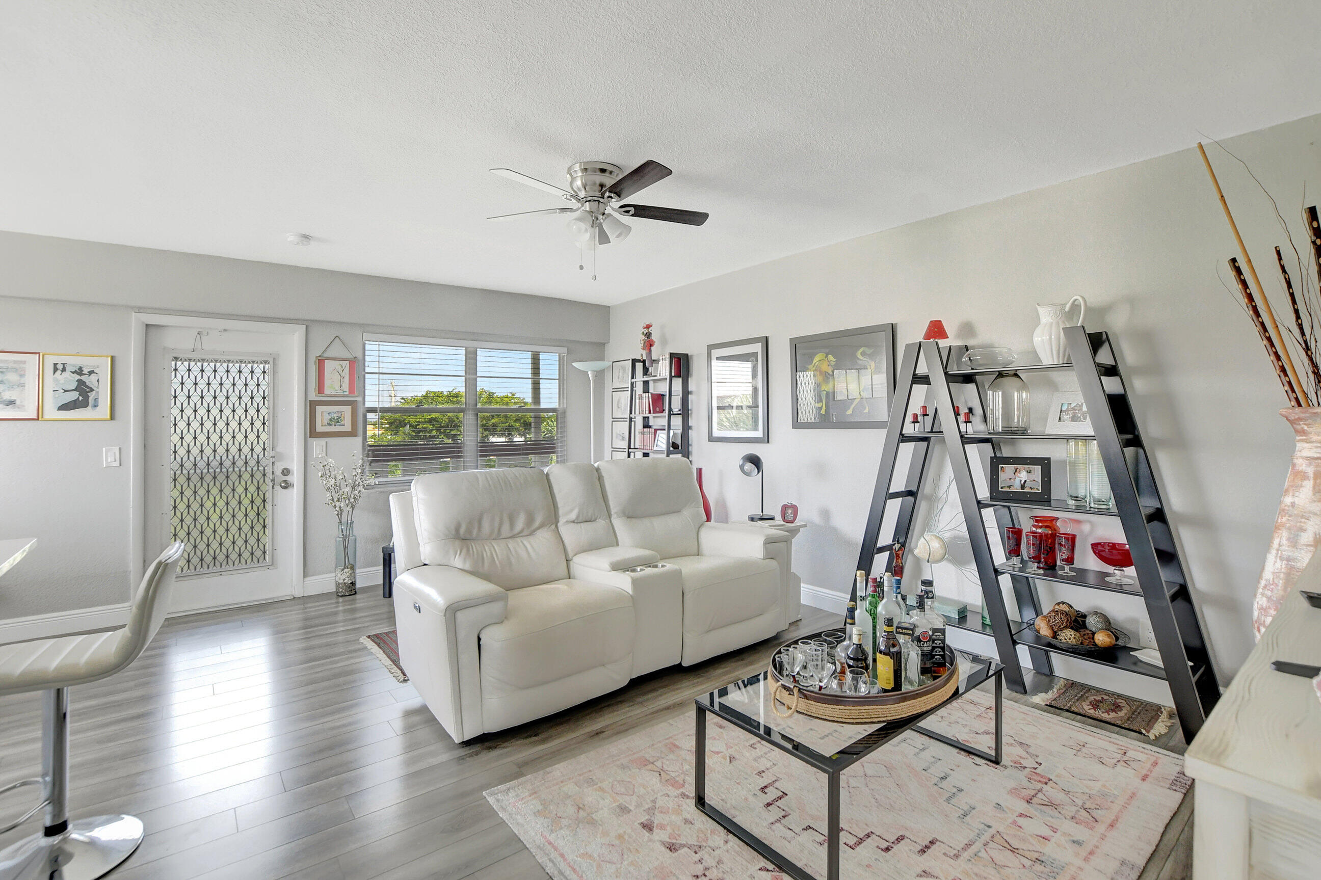 42 Brighton A Boca Raton, FL 33434 - Photo 8 of 24 a living room with furniture and a flat screen tv