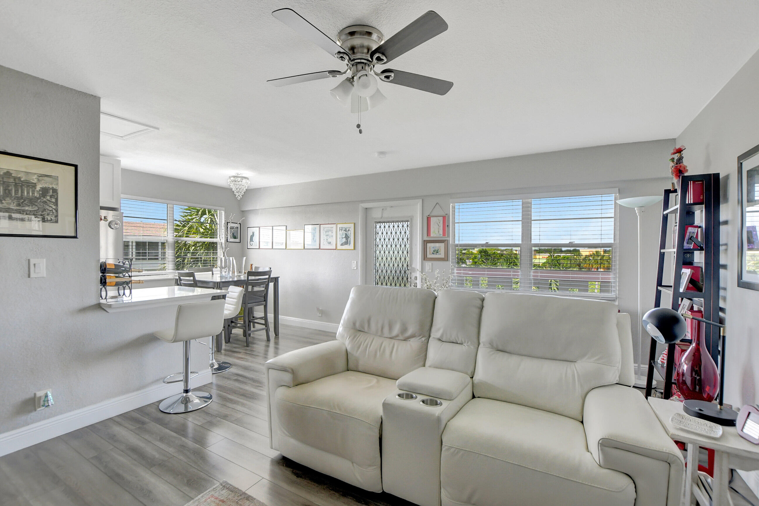 42 Brighton A Boca Raton, FL 33434 - Photo 9 of 24 a living room with furniture and a window