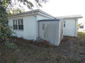 4392 Craftsbury Drive New Port Richey, FL 34652 - Photo 3 of 41 a view of a house with backyard and garden