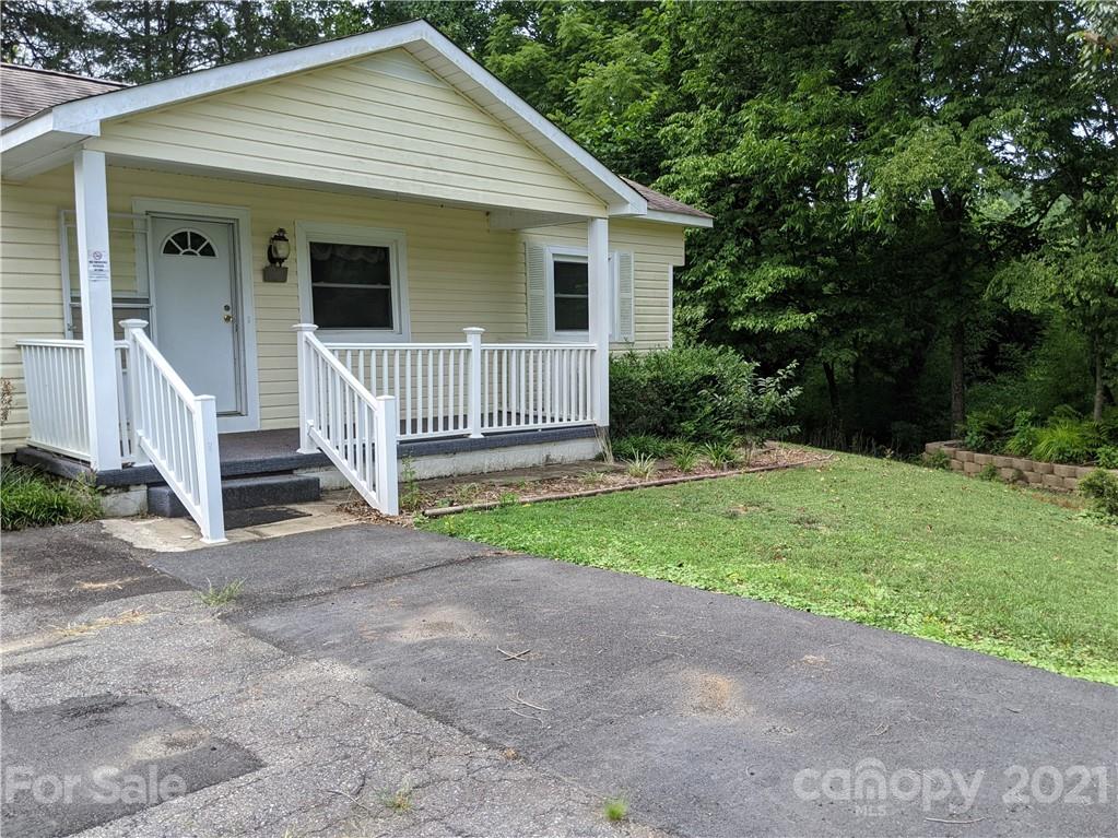 204 Water Filter Plant Road Morganton, NC 28655 - Photo 2 of 13 a view of a small house with wooden fence