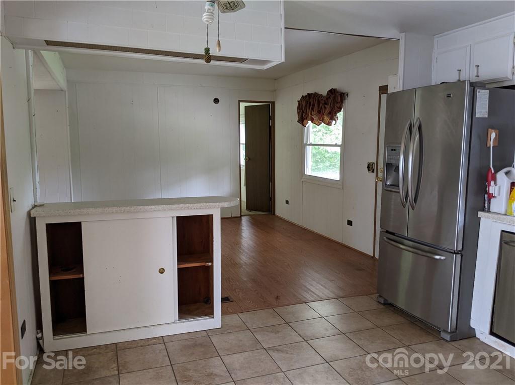 204 Water Filter Plant Road Morganton, NC 28655 - Photo 3 of 13 a kitchen with stainless steel appliances granite countertop a refrigerator and a refrigerator