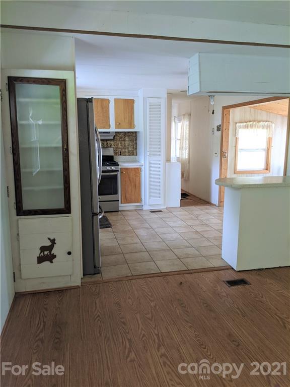 204 Water Filter Plant Road Morganton, NC 28655 - Photo 4 of 13 a view of kitchen with windows and refrigerator