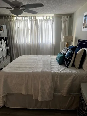 a bedroom with a bed and a chair