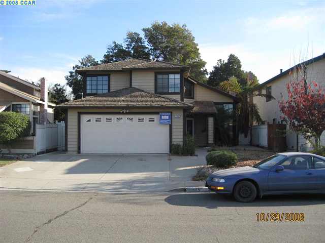 a car parked in front of a house