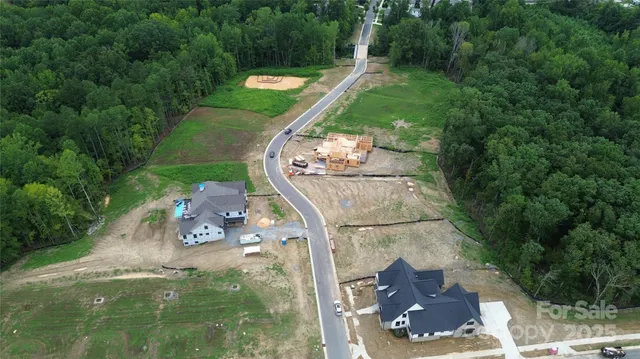 an aerial view of a house with outdoor space