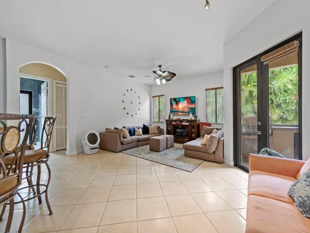 a view of a livingroom with furniture and a large window