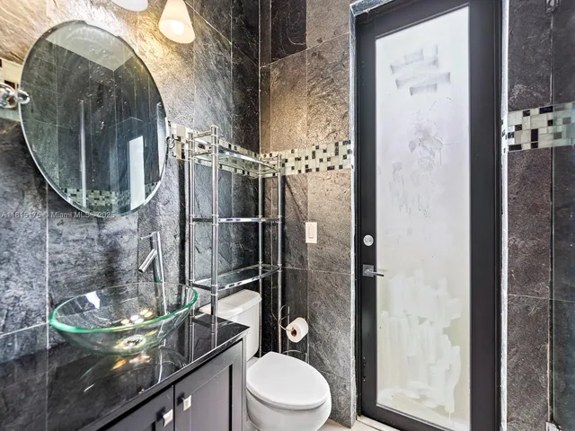 a bathroom with a toilet and a sink