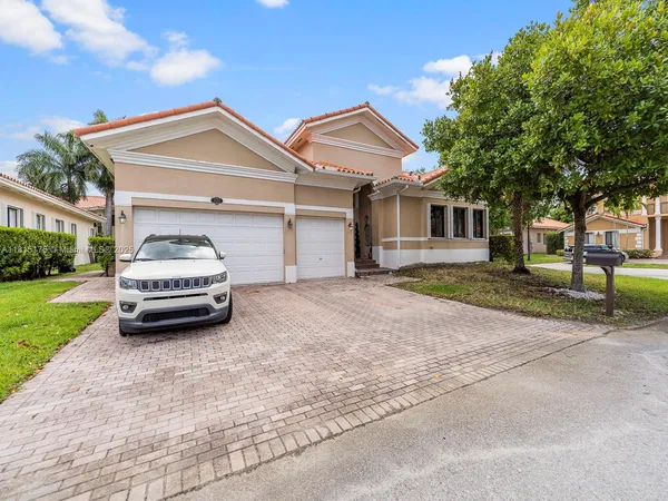 a car parked in front of a house