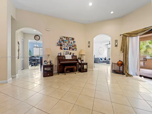 a room with lots of furniture and view of living room