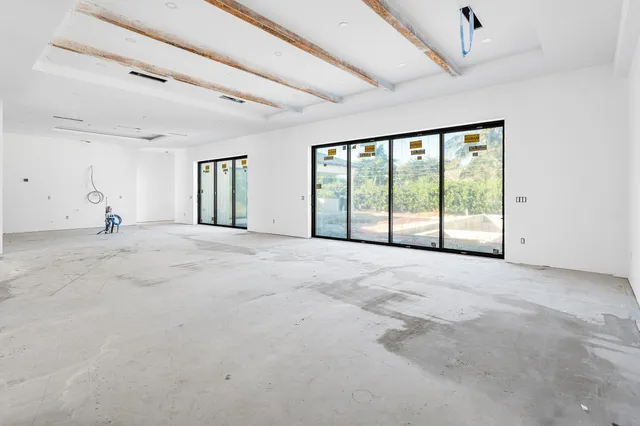 a view of an empty room with a balcony