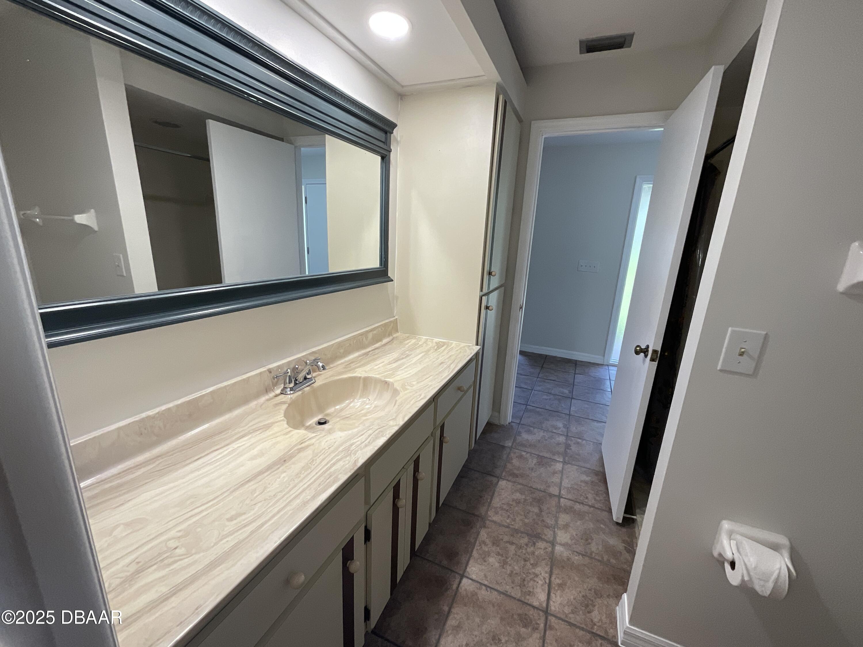 8 Ridge Trail Ormond Beach, FL 32174 - Photo 14 of 24 a bathroom with a granite countertop sink and mirror