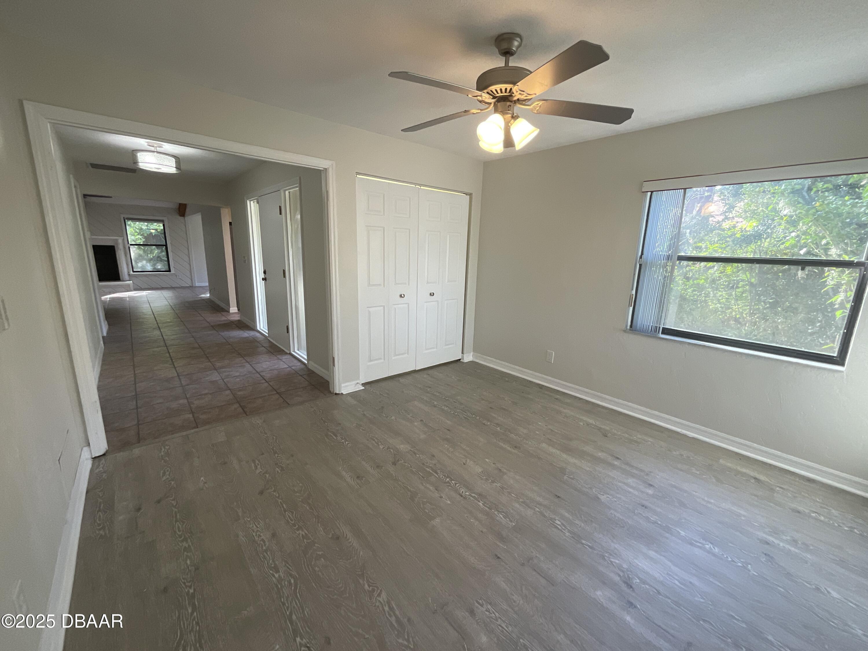 8 Ridge Trail Ormond Beach, FL 32174 - Photo 17 of 24 an empty room with fan and windows