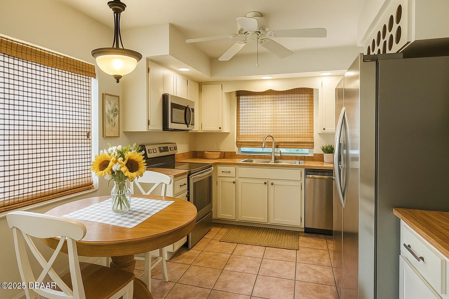 8 Ridge Trail Ormond Beach, FL 32174 - Photo 7 of 24 a kitchen with a sink a stove and chairs