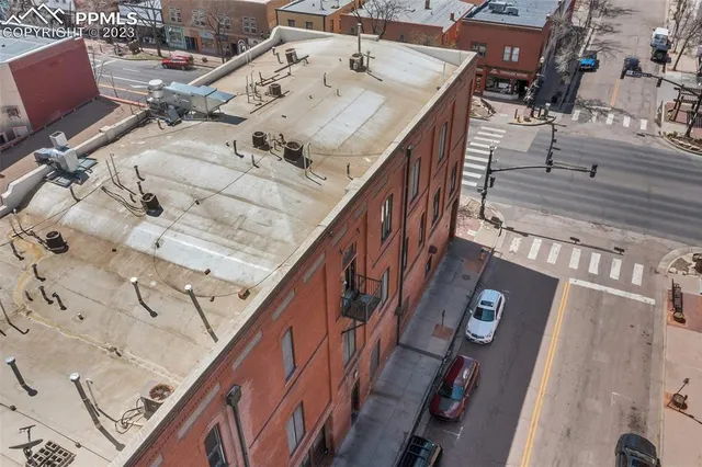a terrace with outdoor seating and wooden floor