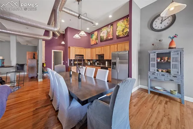 a view of a dining area with furniture and a chandelier