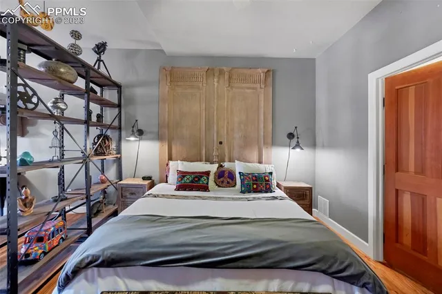 a bedroom with a bed and walk in closet