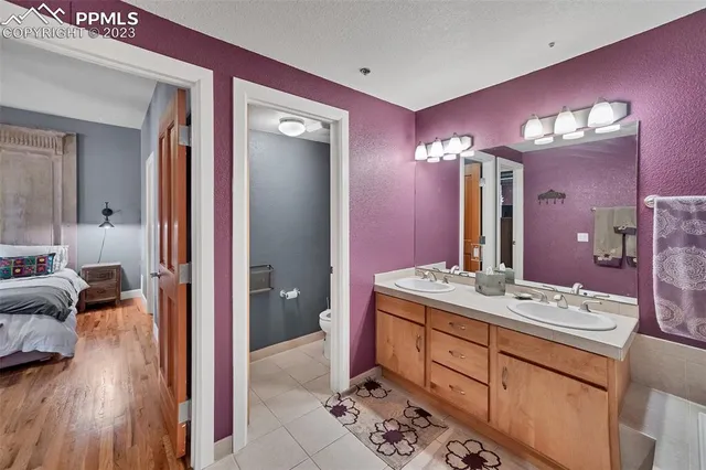 a bathroom with a sink vanity and a mirror