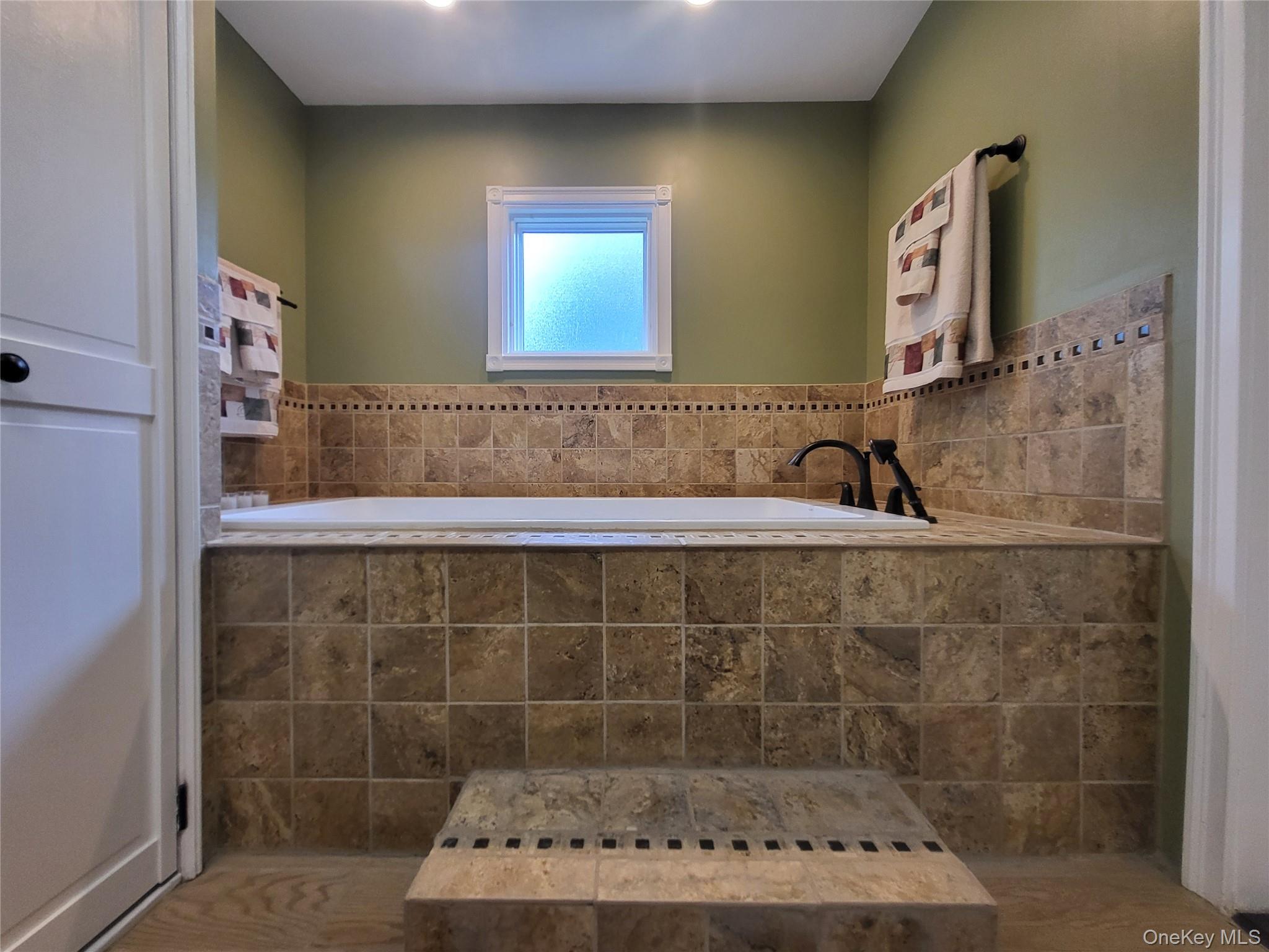 286 Dingle Daisy Road Monticello, NY 12701 - Photo 18 of 35 a bathroom with a sink and a mirror