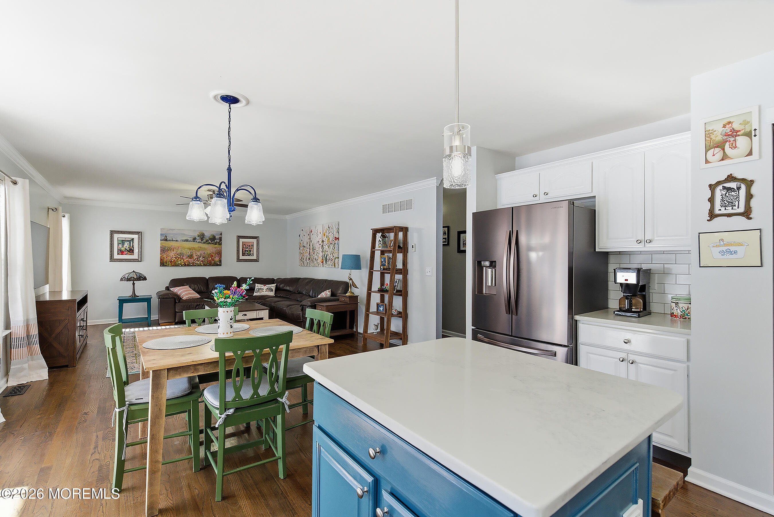 197 Inlet Avenue Manahawkin, NJ 08050 - Photo 12 of 36 a kitchen with stainless steel appliances kitchen island granite countertop a refrigerator a stove a kitchen island a dining table and chairs with wooden floor