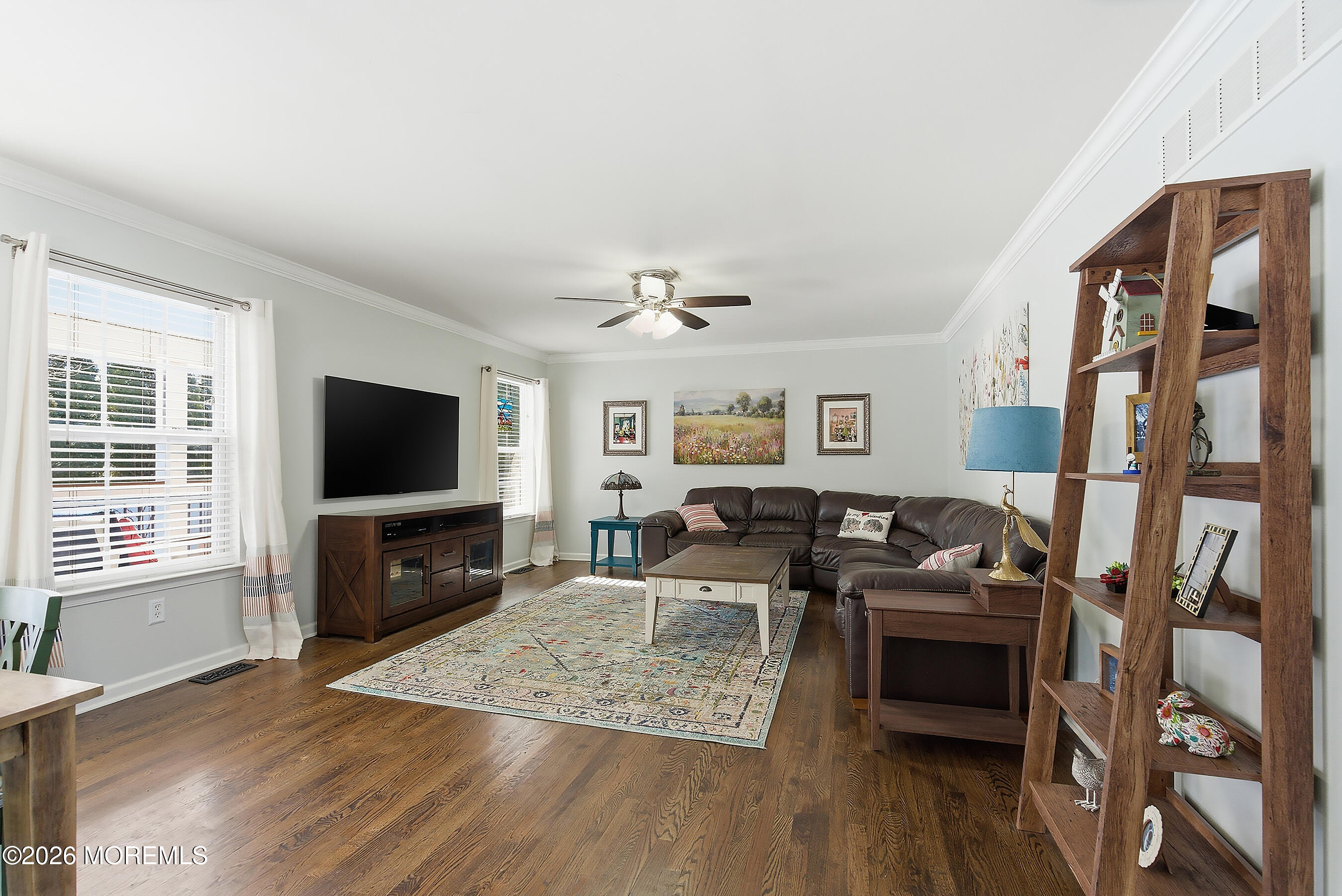 197 Inlet Avenue Manahawkin, NJ 08050 - Photo 14 of 36 a living room with furniture and a flat screen tv